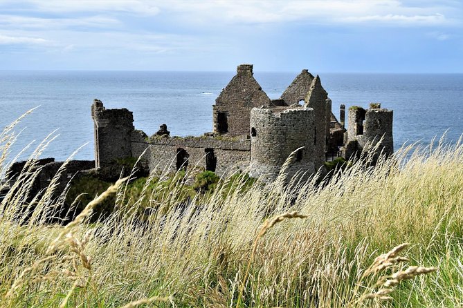 2-Day Northern Ireland Rail Tour: Belfast, Antrim Coast, and Giant's Causeway - Carrick-a-Rede Rope Bridge and the cliffs beyond