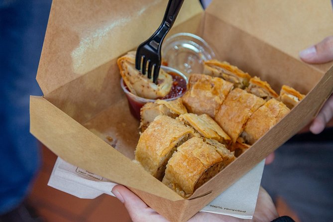 Dublin Private Walking Food Tour With Locals with 10 Tastings - Trinity College adds a grand city backdrop