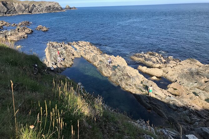Toe Head Clifftop Hike in West Cork - The EIRE sign and an Iron Age promontory fort